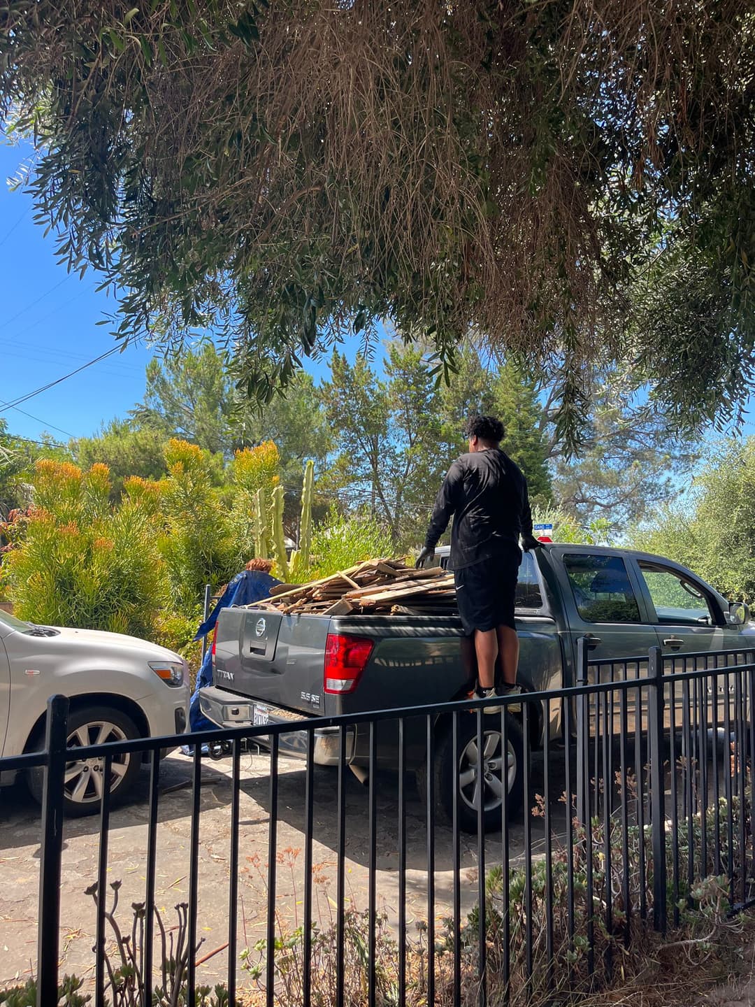 Junk Being loaded on a truck by M Junk Removal and Escondido Junk Removal